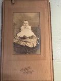PHOTO OF BABY IN WHITE DRESS BLACK AND WHITE