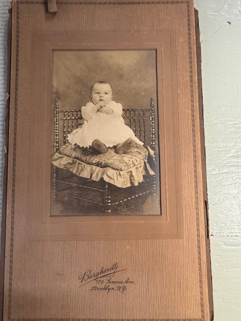 PHOTO OF BABY IN WHITE DRESS BLACK AND WHITE