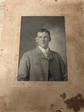 PHOTO OF MAN IN TWEETED JACKET BLACK AND WHITE