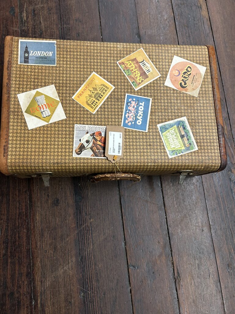 SUITCASE WITH OLD STRAP